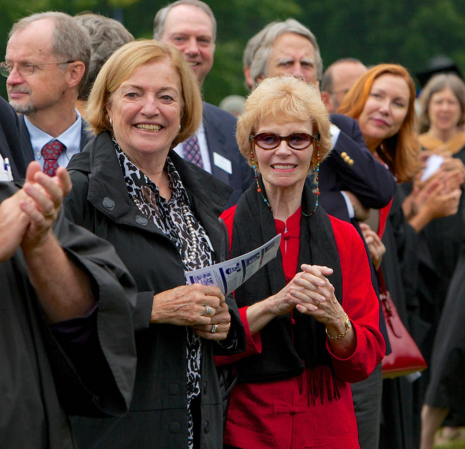 Nan Strauch standing in front of a crowd of people.