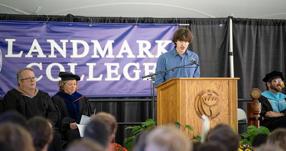 A person gives a speech while standing at a podium.