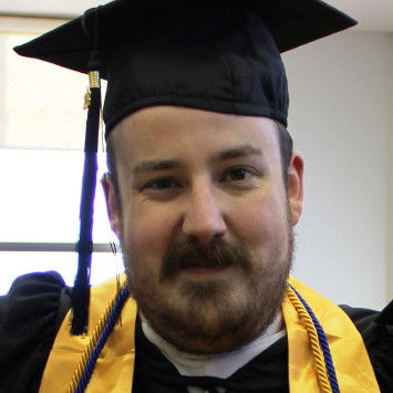 Robert Brennan in cap and gown.