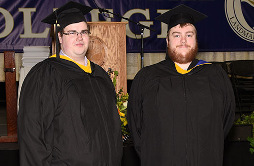 Two students in cap and gown.