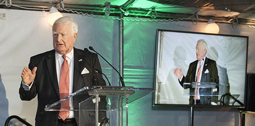 Charles Strauch speaking at the podium.
