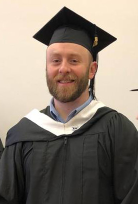 Taylor McQuade sporting his graduation cap and gown.