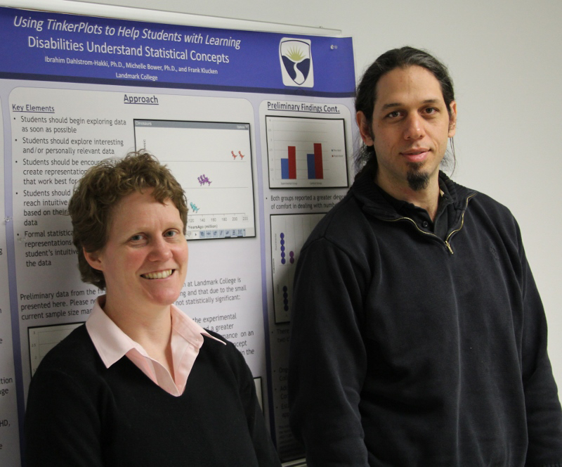 Bower and Dahlstrom-Hakki with a poster behind them.