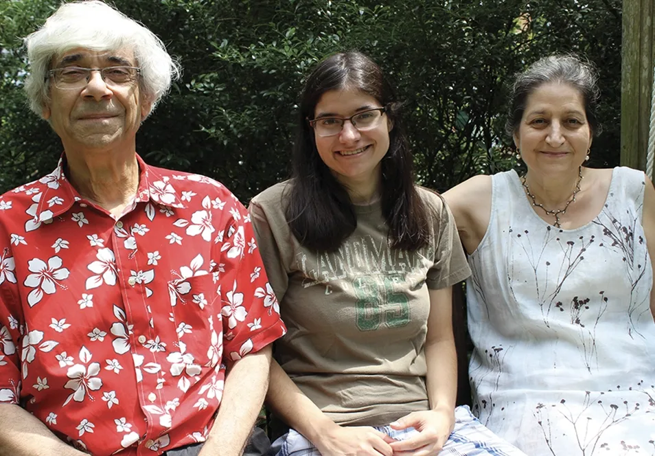 Kaboolian family sitting together and smiling.