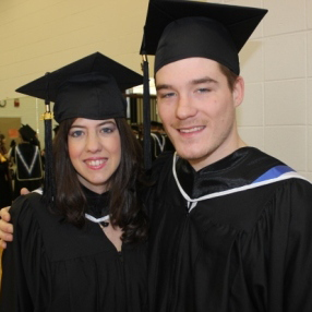 Zachary Zoidis posing for a photo with a colleague at graduation