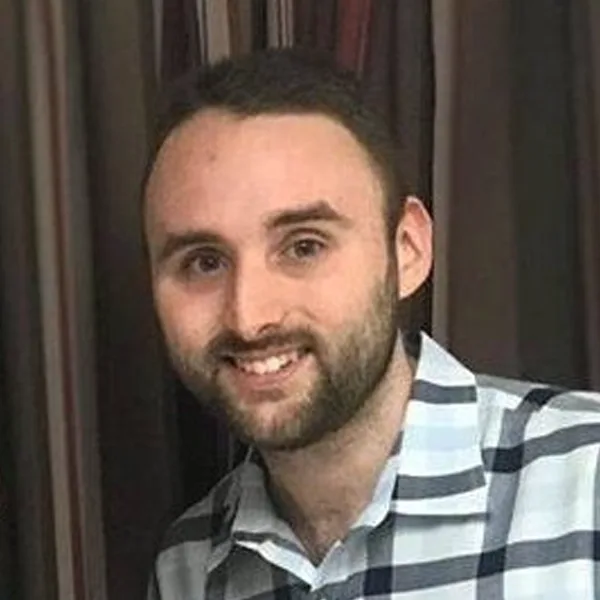 Headshot of Nathan Hughes.